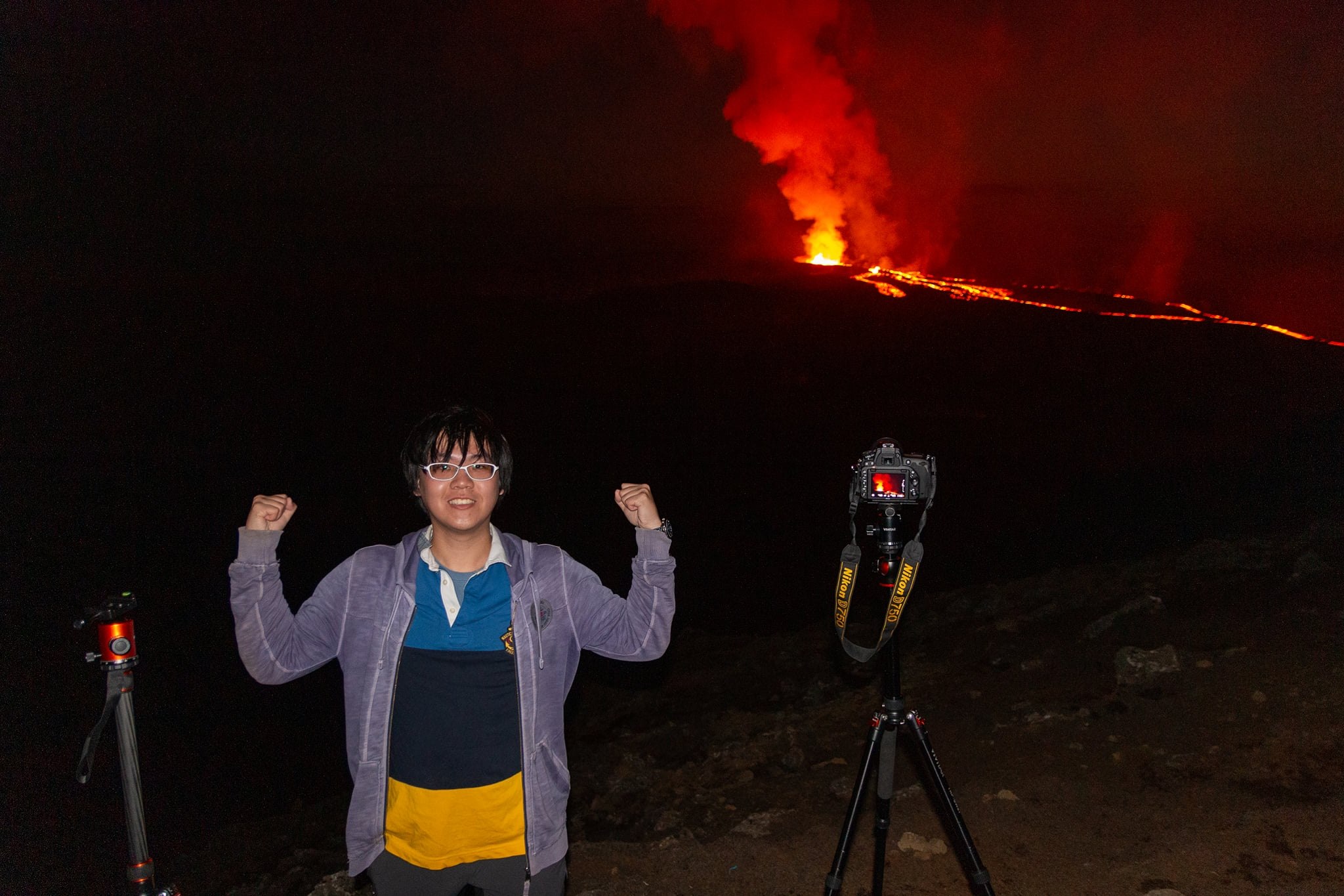 Picture of me stading in front of a volcano with lava, Iceland.